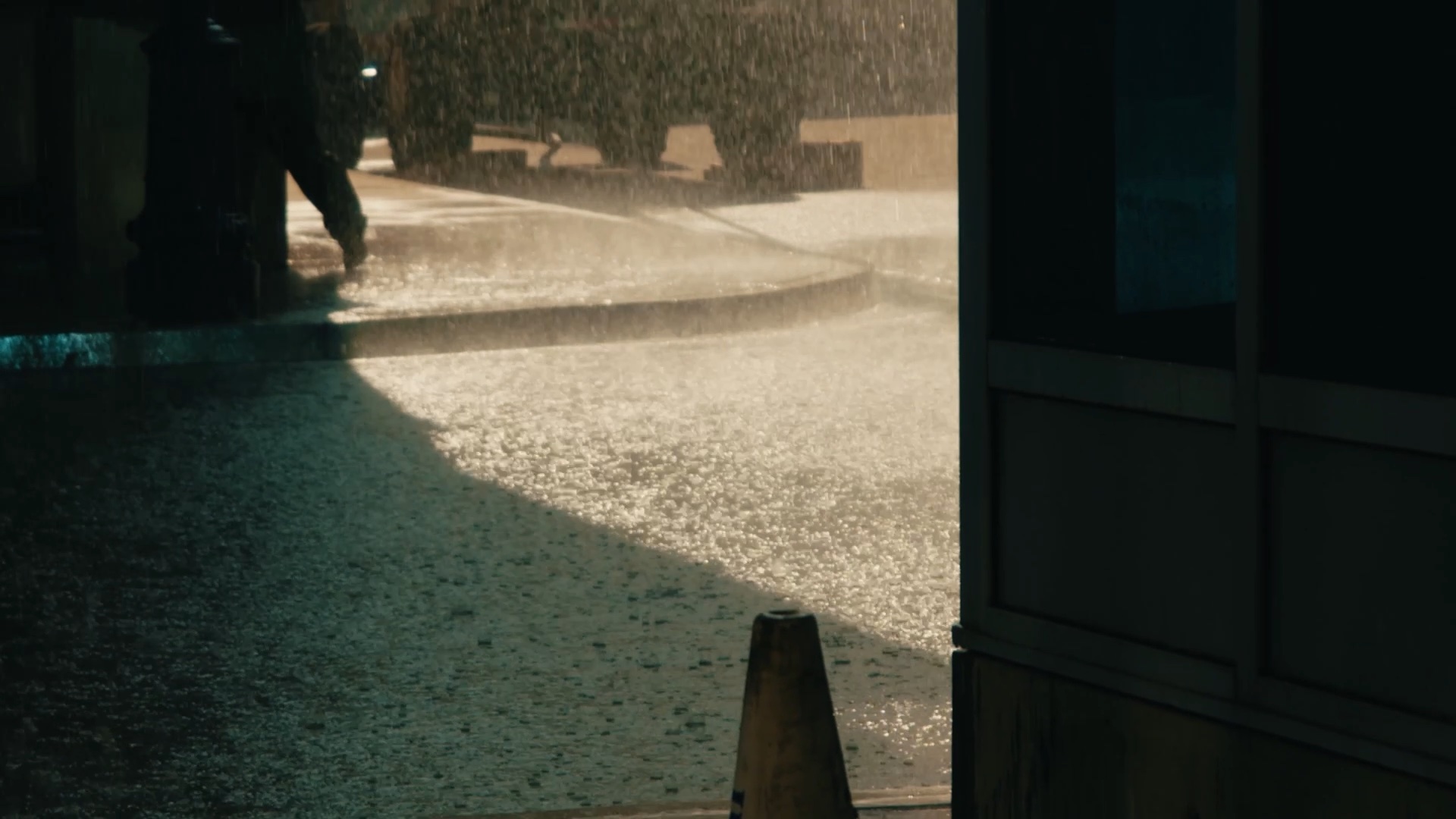 On set — a period street build with camera cranes and crew